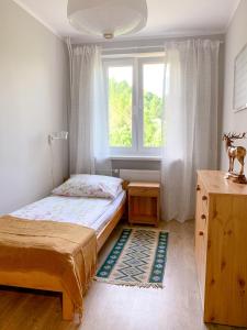 Posteľ alebo postele v izbe v ubytovaní Między górami. Apartament w Cisnej