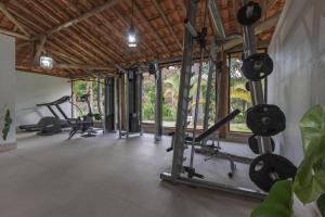 a gym with several treadmills and exercise bikes at Resort Fazenda 3 Pinheiros in Engenheiro Passos