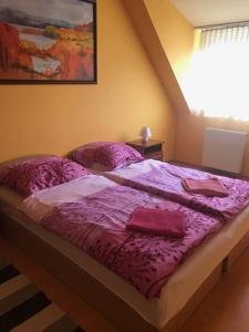 Posteľ alebo postele v izbe v ubytovaní Vida Apartman
