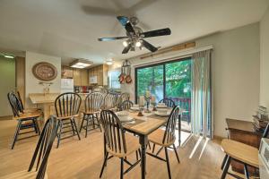 a dining room with a table and chairs at Pine Mountain Lake Haven with Spacious Deck! in Groveland