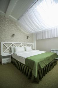 Postel nebo postele na pokoji v ubytování Hotel Litera