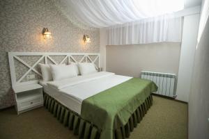 Postel nebo postele na pokoji v ubytování Hotel Litera