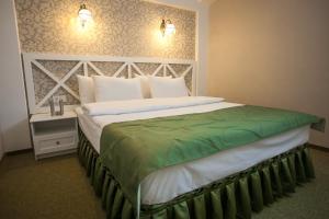Postel nebo postele na pokoji v ubytování Hotel Litera