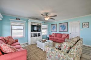 a living room with two couches and a ceiling fan at Large-Group Getaway - Beachfront Home with Pool! in Holden Beach