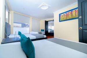 Postel nebo postele na pokoji v ubytování Hotel Ayenda Normandy + 29 fotografií