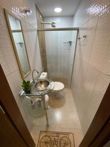a bathroom with a shower and a toilet and a sink at Casa Maragogi in Maragogi +28 photos