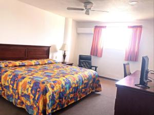 Postel nebo postele na pokoji v ubytování Hotel Paquime