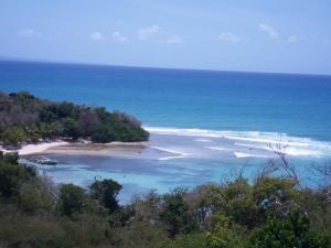 an island in the middle of the ocean at La cabane du pêcheur in Le Gosier