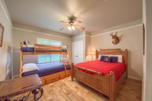 a bedroom with two bunk beds and a ceiling fan at RR 9084TS Texas Star in Canyon Lake