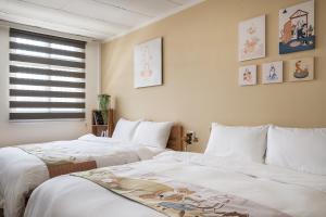 Voodi või voodid majutusasutuse Hibnb Guesthouse toas
