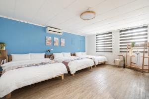 Voodi või voodid majutusasutuse Hibnb Guesthouse toas