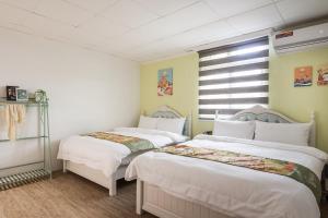 Voodi või voodid majutusasutuse Hibnb Guesthouse toas