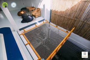 a bird cage sitting on top of a boat at Aekkeko hostel in Phuket Town