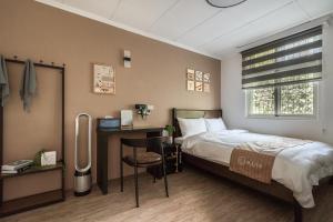 Voodi või voodid majutusasutuse Hibnb Guesthouse toas