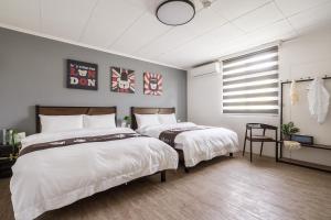 Voodi või voodid majutusasutuse Hibnb Guesthouse toas
