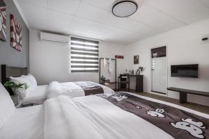 Voodi või voodid majutusasutuse Hibnb Guesthouse toas