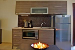 Kuchyň nebo kuchyňský kout v ubytování Chasapis Luxury Studios & Apartments