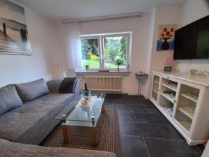 a living room with a couch and a table at Ferienwohnung Ida in Traben-Trarbach
