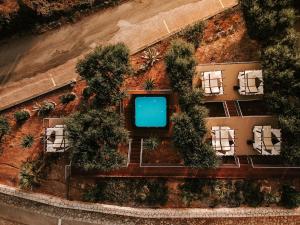 an aerial view of a resort with a pool at Natura Club Hotel & Spa - Adults Only in Kyparissia