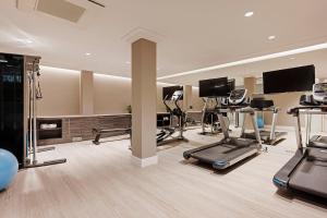 a gym with several exercise equipment in a room at Áurea Ana Palace by Eurostars Hotel Company in Budapest