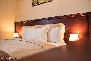 Voodi või voodid majutusasutuse Arève Résidence Boutique Hotel toas