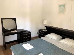 Posteľ alebo postele v izbe v ubytovaní Armstrong Apartments