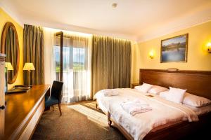 Posteľ alebo postele v izbe v ubytovaní Hotel International