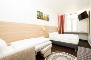 Postel nebo postele na pokoji v ubytování Hotel National + 37 fotografií