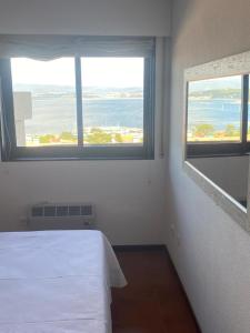 Posteľ alebo postele v izbe v ubytovaní URB. PEDRAS NEGRAS
