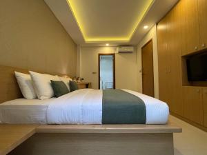 מיטה או מיטות בחדר ב-Huvan Beach Hotel at Hulhumale
