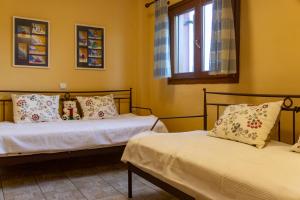 Postel nebo postele na pokoji v ubytování Seaview Maisonette