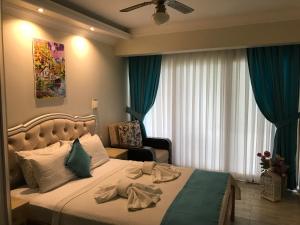 Postel nebo postele na pokoji v ubytování Mola Hotel