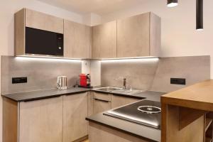 A kitchen or kitchenette at Apartments Montblanc Sella