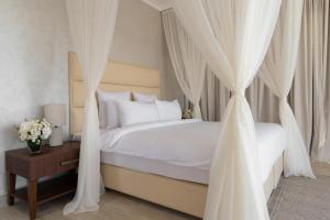 Voodi või voodid majutusasutuse Regency Sealine Camp toas