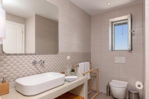 Ванная комната в Isalos Villas Naxos
