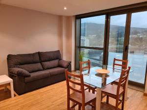 A seating area at APARTAMENTOS VIVE