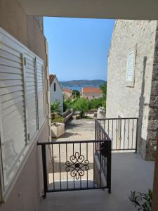 a view from a balcony of a building with a gate at House Pierro in Orasac