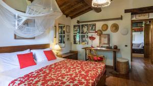 a bedroom with a large bed and a desk at LA CERQUA 8, Emma Villas in Gualdo Cattaneo +52 photos