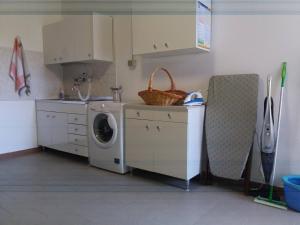 Η κουζίνα ή μικρή κουζίνα στο Casa Intignano - Camera con bagno e portico vista lago