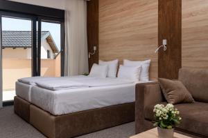 Postel nebo postele na pokoji v ubytování Holiday Park Zagyland