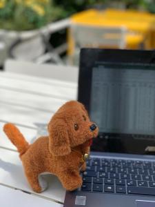 a teddy bear sitting on top of a laptop computer at Holiday Inn Paris Montmartre, an IHG Hotel in Paris