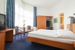 Postel nebo postele na pokoji v ubytování Hotel Der Achtermann