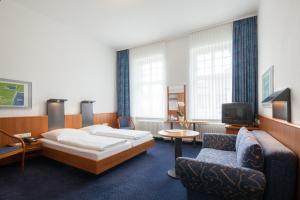 TV a/nebo společenská místnost v ubytování Hotel Der Achtermann