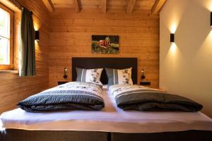 Postel nebo postele na pokoji v ubytování Almdorf Vorderbrand