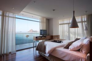 Postel nebo postele na pokoji v ubytování H Niteroi Hotel