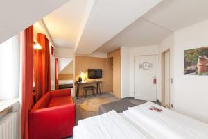 TV a/nebo společenská místnost v ubytování Sure Hotel by Best Western Muenchen Hauptbahnhof