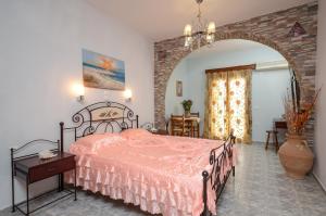 Ένα ή περισσότερα κρεβάτια σε δωμάτιο στο Orama Apartments