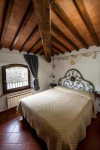 Voodi või voodid majutusasutuse Hotel Vecchia Oliviera toas