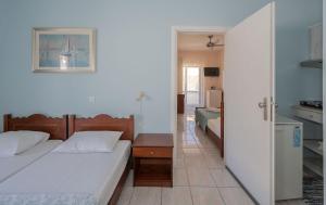 Posteľ alebo postele v izbe v ubytovaní Maria's Hotel