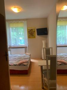 Posteľ alebo postele v izbe v ubytovaní Apartamenty pokoje "MARIA"